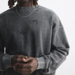 Distressed sweatshirt detail