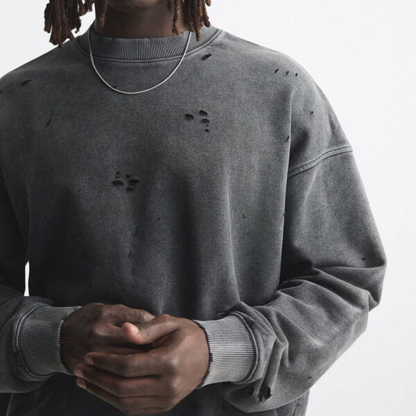 Distressed sweatshirt detail