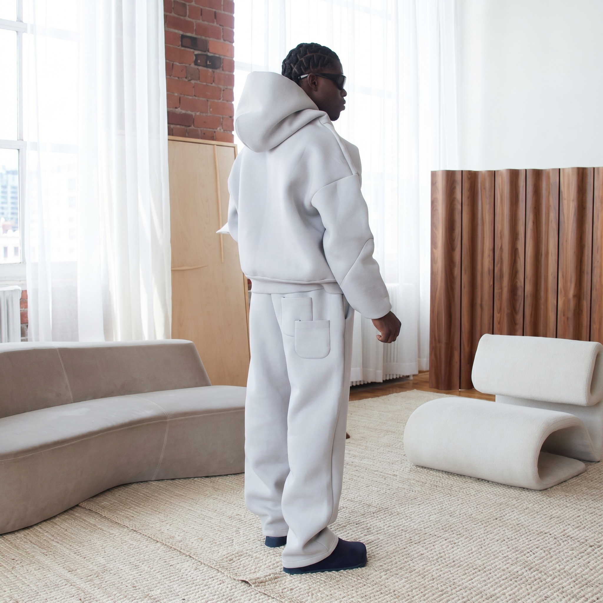Side view of custom heavyweight hoodie and sweatpants set for OEM/ODM