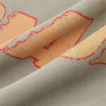 Puff print sleeve detail on vintage washed hoodie