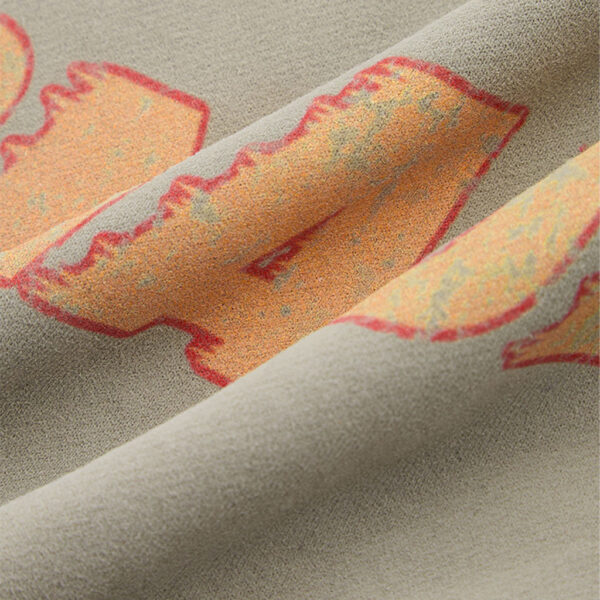 Puff print sleeve detail on vintage washed hoodie