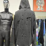 Distressed hoodie fabric detail with ripped effect