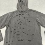 Custom distressed hoodie flat lay front view